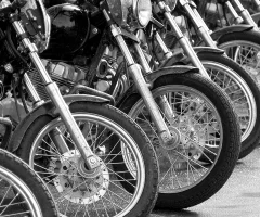 A row of motorcycles lined up ready for a ride