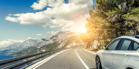 A car driving along a scenic road in Mexico