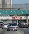 Cars waiting to cross the border, lined up at a border crossing checkpoint