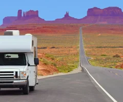 An RV driving on a scenic road