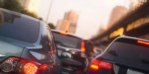 A traffic jam on a busy road in Mexico, with cars lined up and waiting