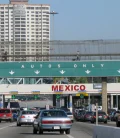 vehicles waiting to obtain the temporary vehicle importation permit at a Mexican border crossing.