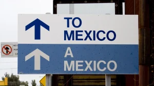 Road sign indicating the way to Mexico