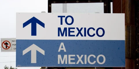 Road sign indicating the way to Mexico