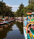 Colorful trajineras floating along the canals of Xochimilco in Mexico City