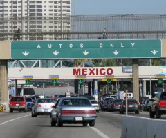 Cars lined up, waiting to cross the Mexican border