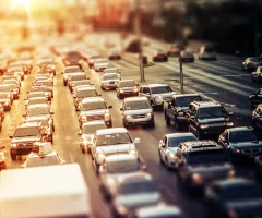 Heavy traffic on a highway, with cars lined up in a congested lane.