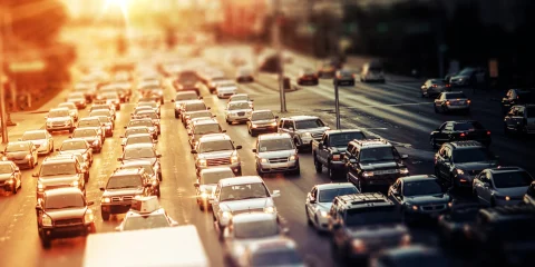 Heavy traffic on a highway, with cars lined up in a congested lane.