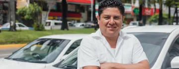 A man picking up his rental car in Mexico